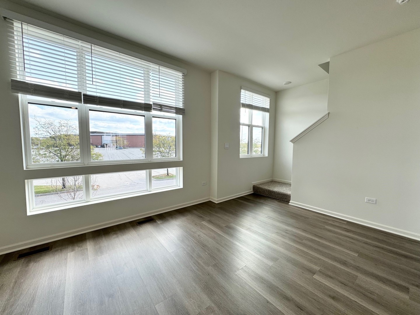369 Summit Circle Lombard, IL 60148 - Photo 6 of 45 an empty room with wooden floor and windows