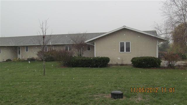 9947 East Center Road Stockton, IL 61085 - Photo 1 of 11 a house view with a garden space
