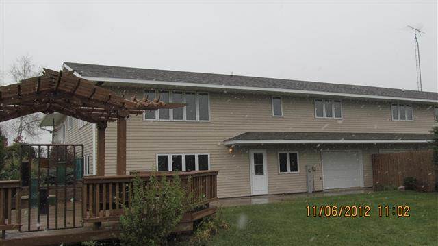 9947 East Center Road Stockton, IL 61085 - Photo 3 of 11 a front view of a house with a garden