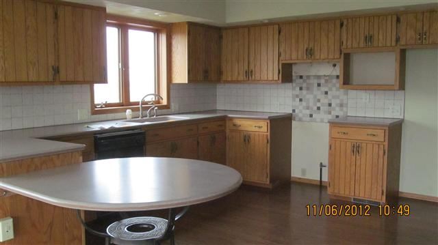 9947 East Center Road Stockton, IL 61085 - Photo 5 of 11 a kitchen with a sink a window and cabinets