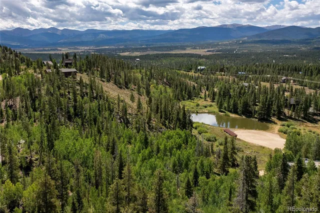 a view of a balcony with a forest view