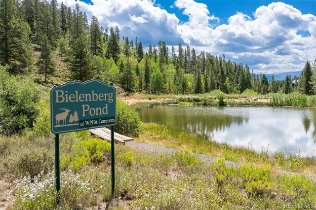 a view of a sign board with lake view