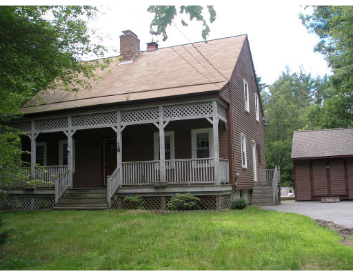 16 Stevens Road Rochester, MA 02770 - Photo 1 of 1 a front view of a house with a garden
