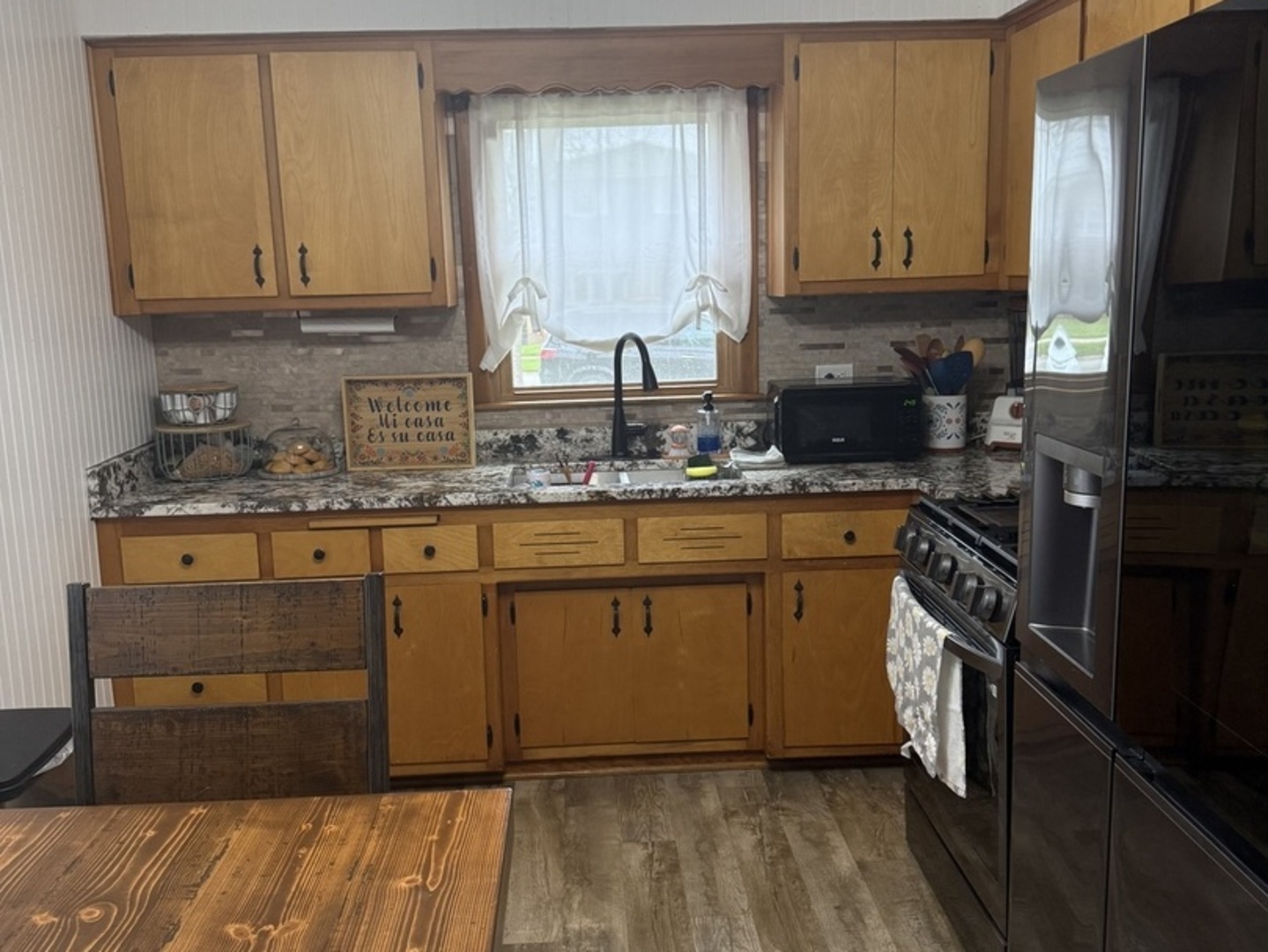 3763 153rd Street Midlothian, IL 60445 - Photo 16 of 17 a kitchen with stainless steel appliances granite countertop a sink stove and refrigerator