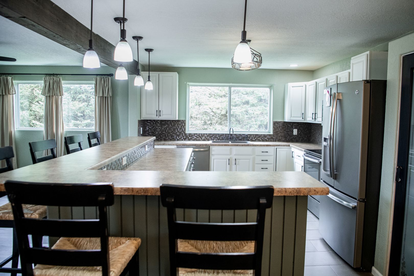 20532 Pilgrim Road Chadwick, IL 61014 - Photo 19 of 54 a kitchen with stainless steel appliances granite countertop a table chairs refrigerator and sink