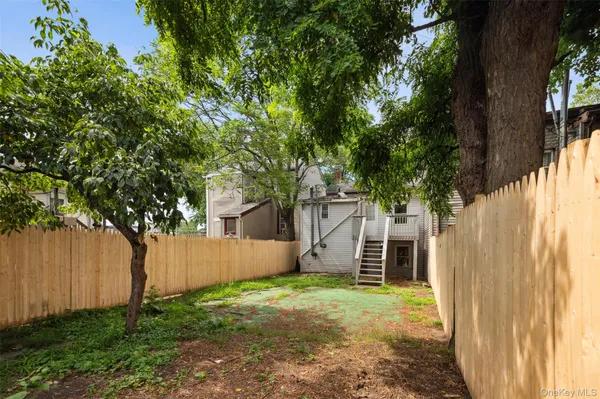 a backyard of a house with lots of green space