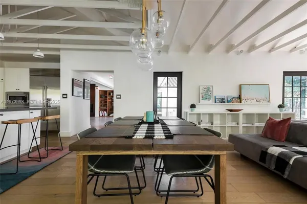 a dining room with furniture and window