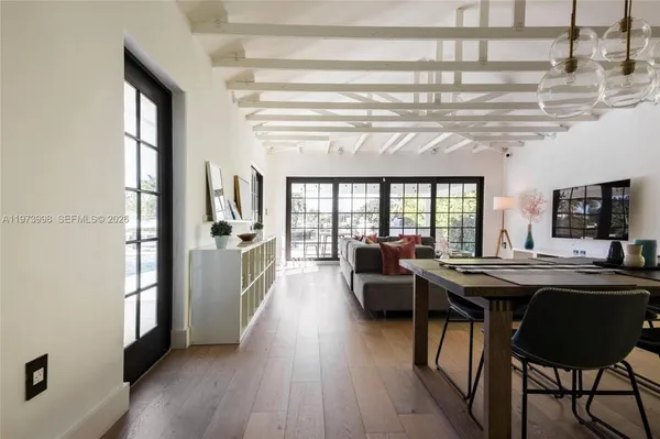 a view of a dining room with furniture window and wooden floor