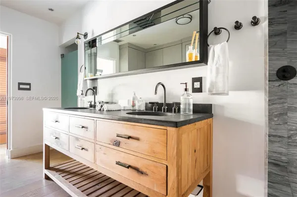 a kitchen with stainless steel appliances a sink and cabinets