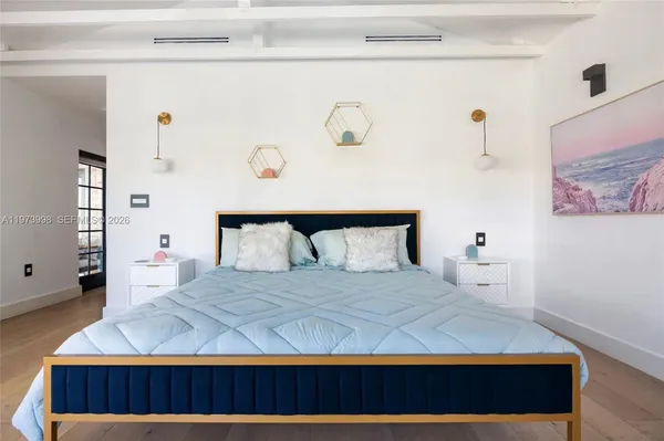 a bedroom with a bed and window