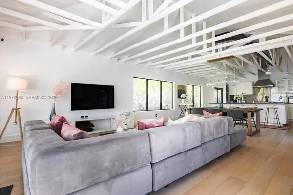 a bedroom with bed and a flat screen tv