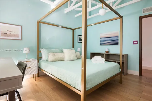 a bedroom with a bed and window