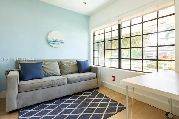 a living room with furniture and a window