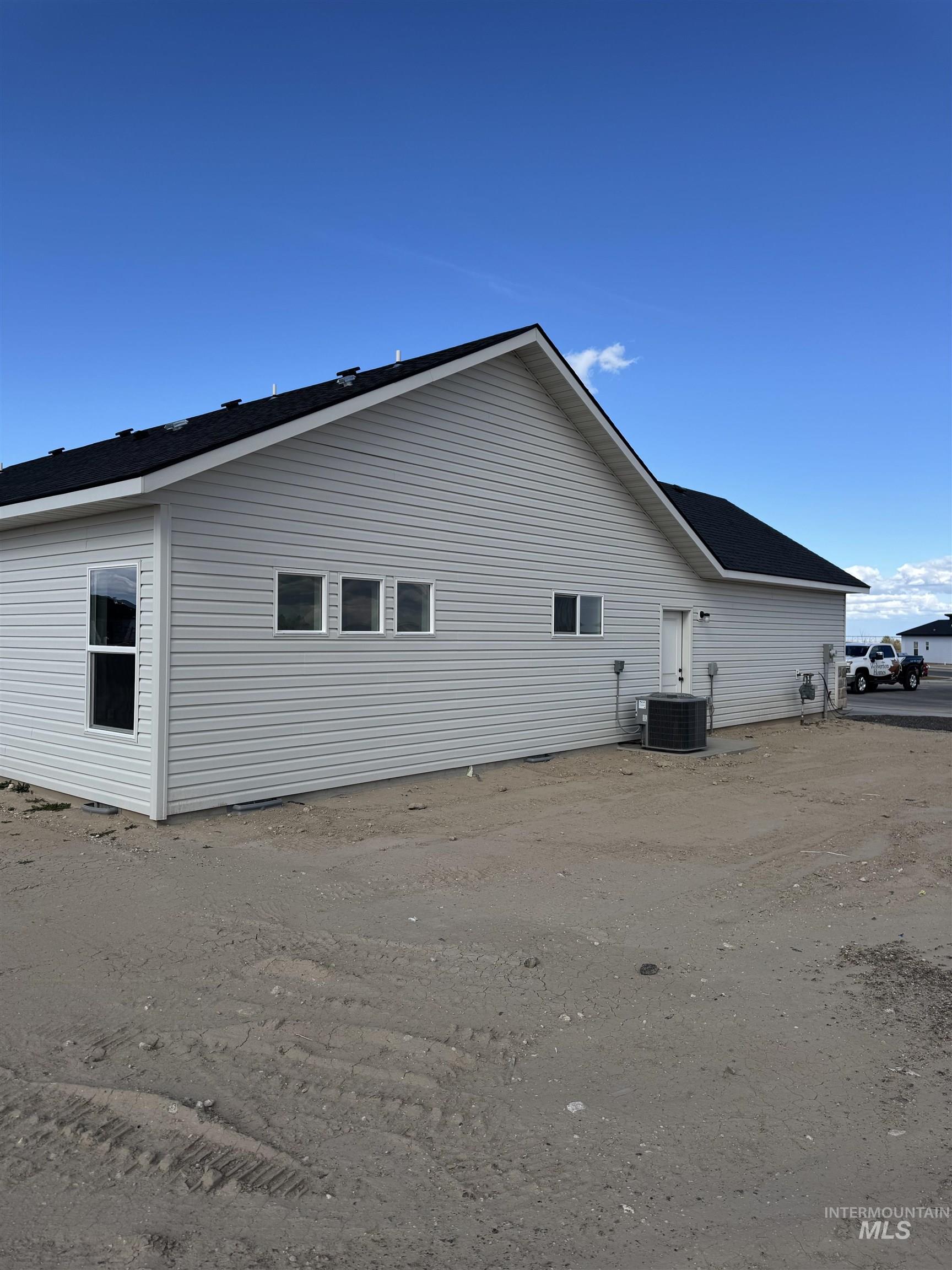 2064 Harrison Street South Twin Falls, ID 83301 - Photo 26 of 29 View of side of property featuring a central AC unit