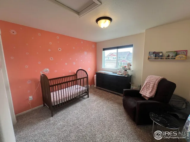 a living room with furniture and window