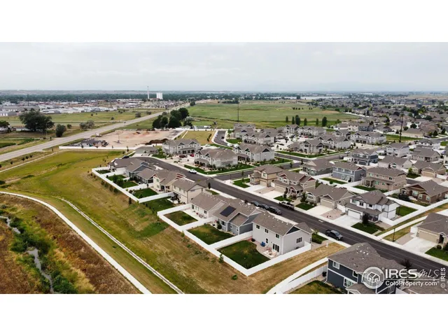 an aerial view of a house with a ocean view