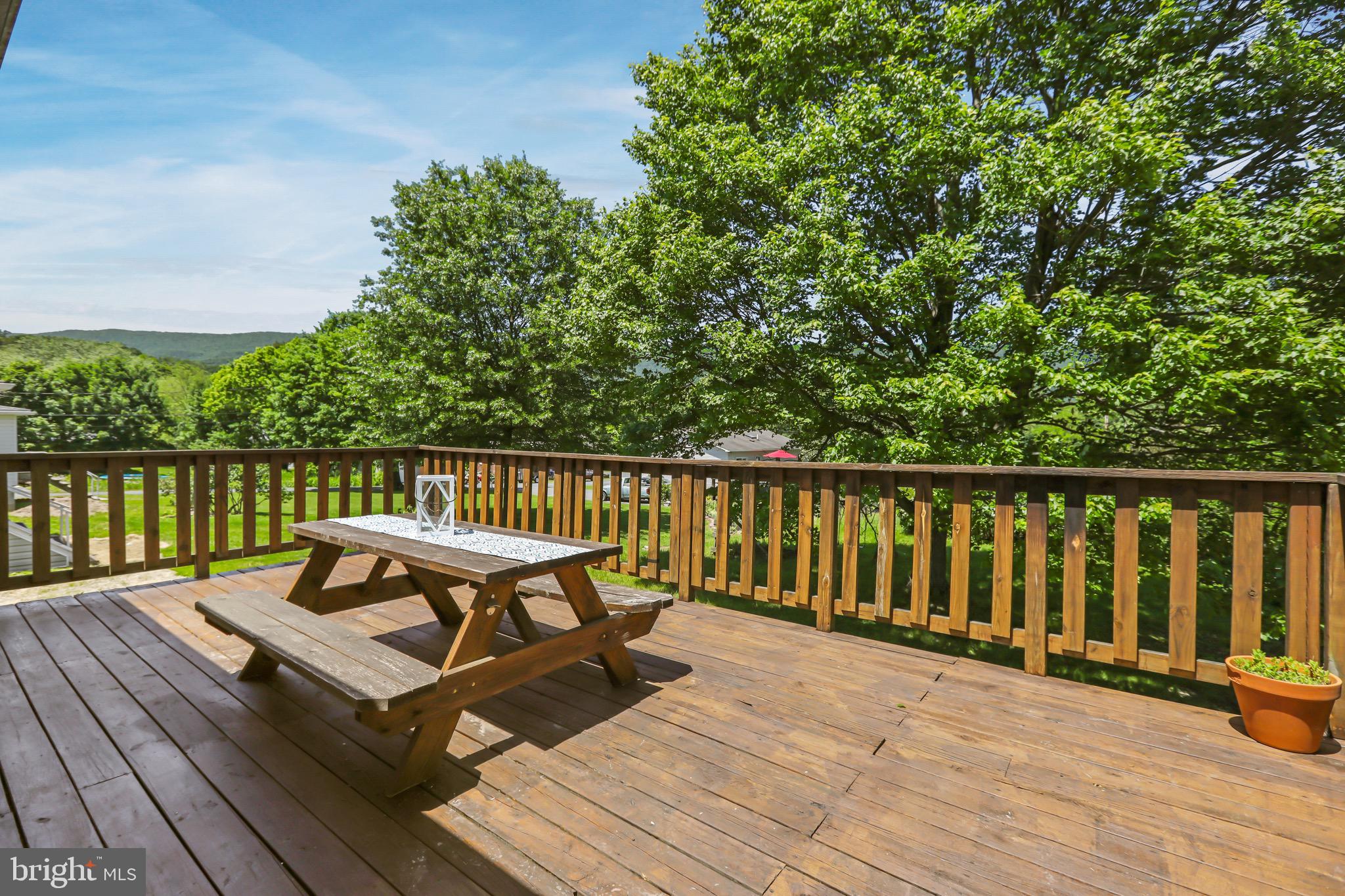 13609 Brant Road Southwest Cresaptown, MD 21502 - Photo 15 of 23 a view of a wooden deck with a bench
