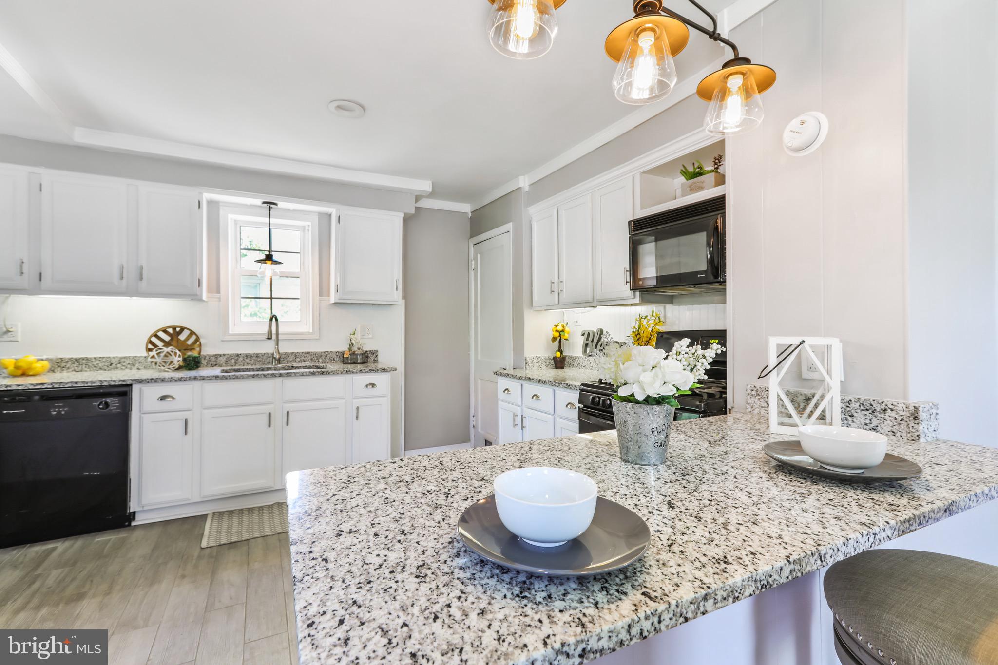 13609 Brant Road Southwest Cresaptown, MD 21502 - Photo 21 of 23 a kitchen with a sink and a stove top oven