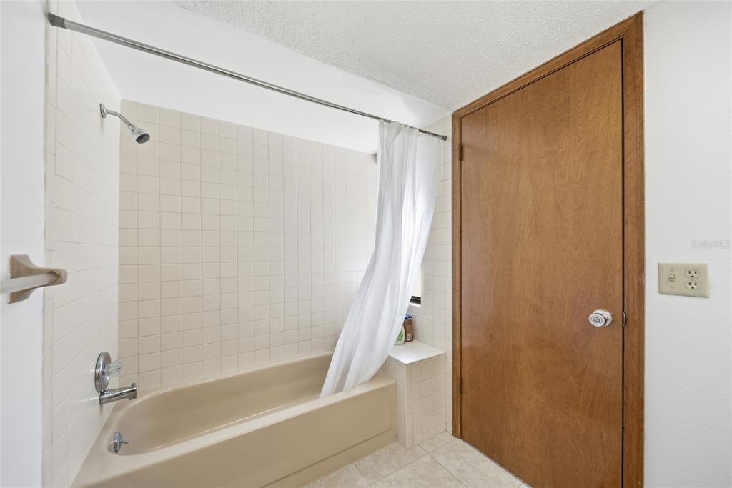 8398 Begonia Street Spring Hill, FL 34608 - Photo 16 of 32 a bathroom with a shower and a tub