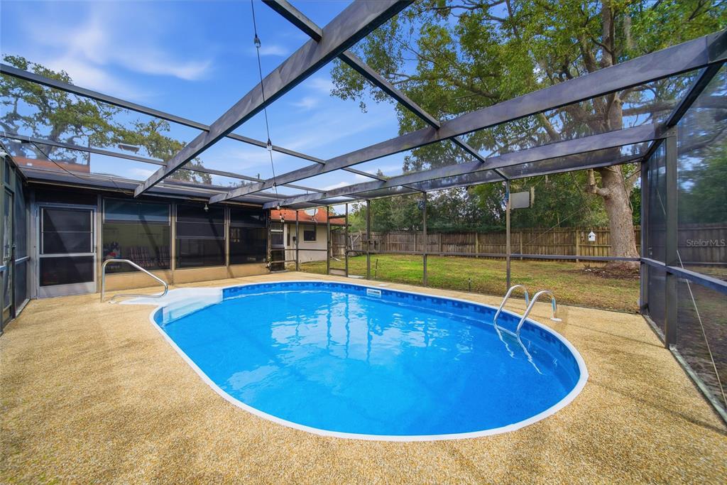8398 Begonia Street Spring Hill, FL 34608 - Photo 22 of 32 a view of indoor pool and sitting area