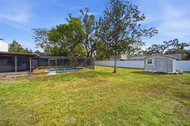 a swimming pool with wooden fence