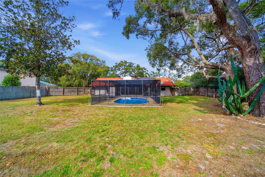8398 Begonia Street Spring Hill, FL 34608 - Photo 24 of 32 a view of a swimming pool with a patio