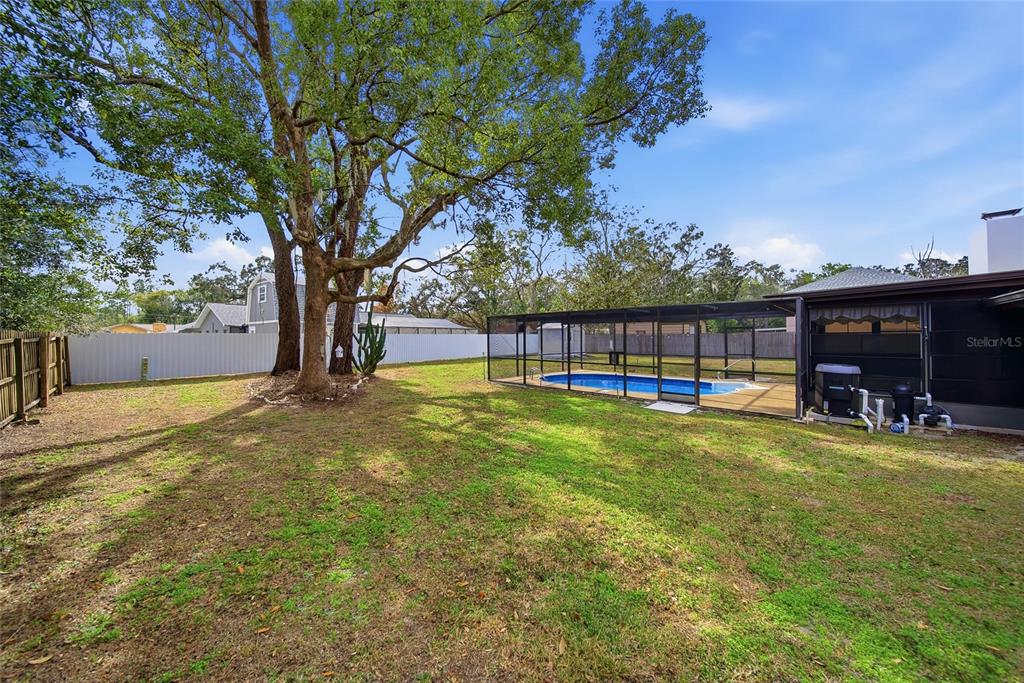 8398 Begonia Street Spring Hill, FL 34608 - Photo 25 of 32 a view of a house with pool and sitting area