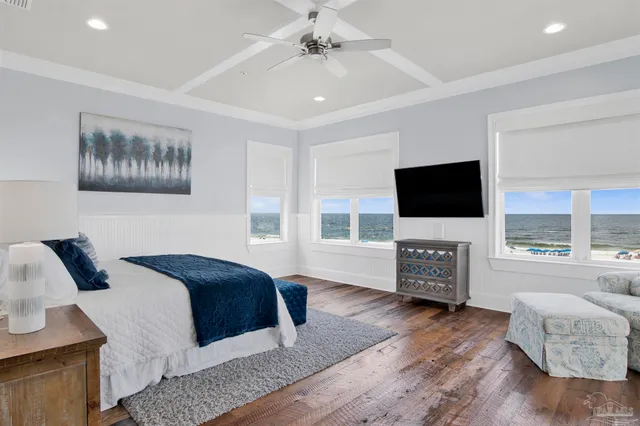a bathroom with a granite countertop sink a mirror and shower