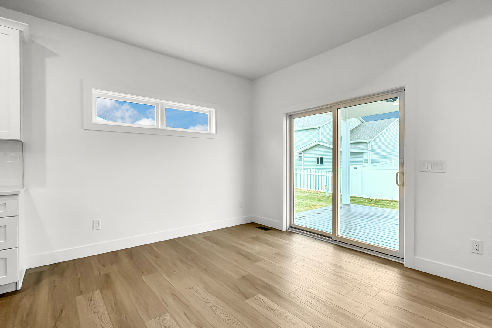 606 Kevin Road Blue Grass, IA 52726 - Photo 28 of 33 an empty room with wooden floor and door
