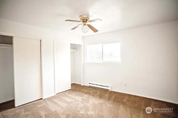 a kitchen with a white cabinets and white appliances