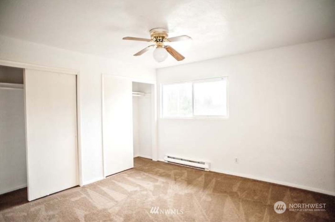 7 Neilton Lane Neilton, WA 98552 - Photo 7 of 11 an empty room with windows and fan