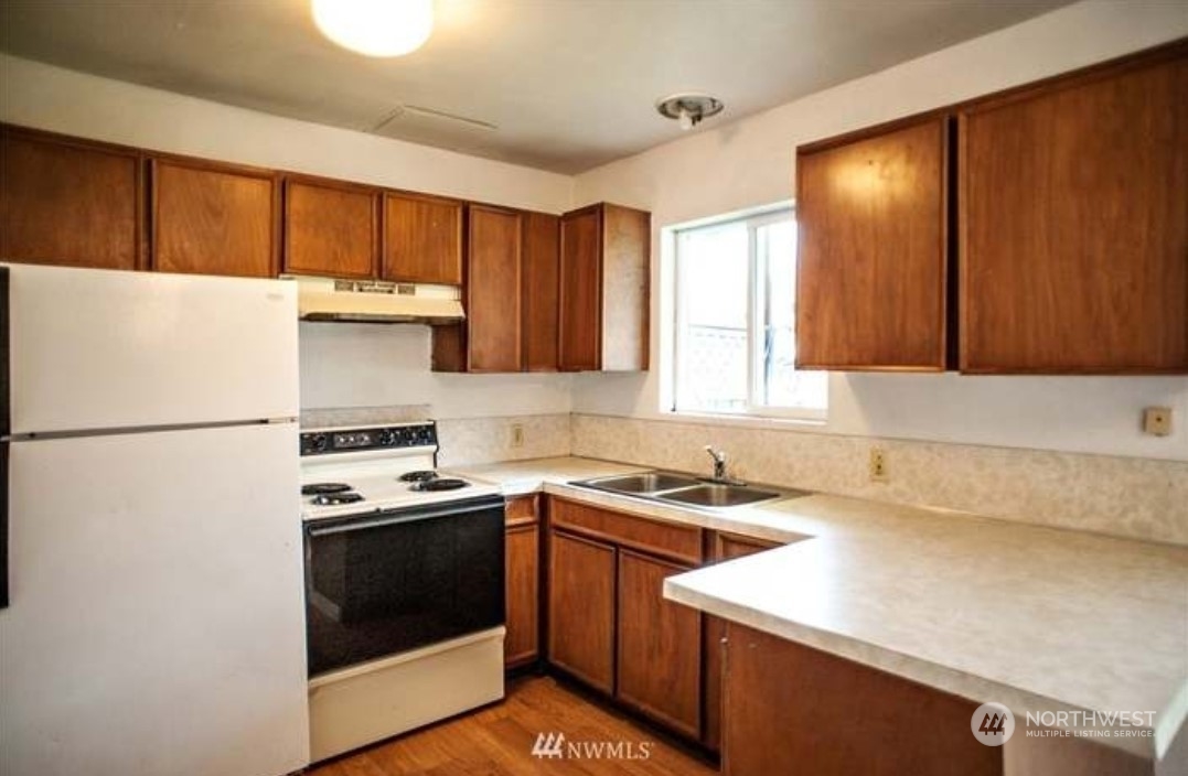 7 Neilton Lane Neilton, WA 98552 - Photo 8 of 11 a kitchen with a white cabinets and white appliances