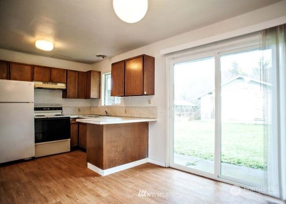 7 Neilton Lane Neilton, WA 98552 - Photo 9 of 11 a kitchen with stainless steel appliances granite countertop a refrigerator sink and stove