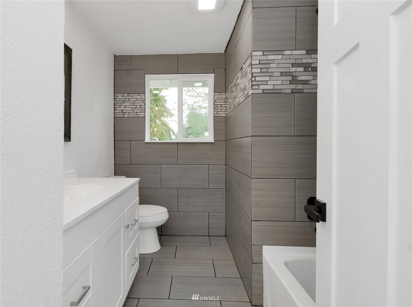19128 Pecan Street Southwest Rochester, WA 98579 - Photo 14 of 31 a bathroom with a sink a toilet and shower