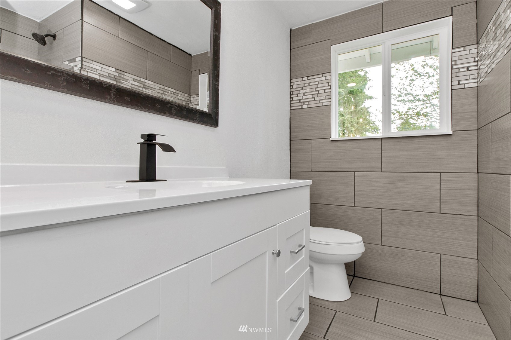 19128 Pecan Street Southwest Rochester, WA 98579 - Photo 15 of 31 a bathroom with a sink a toilet and a mirror
