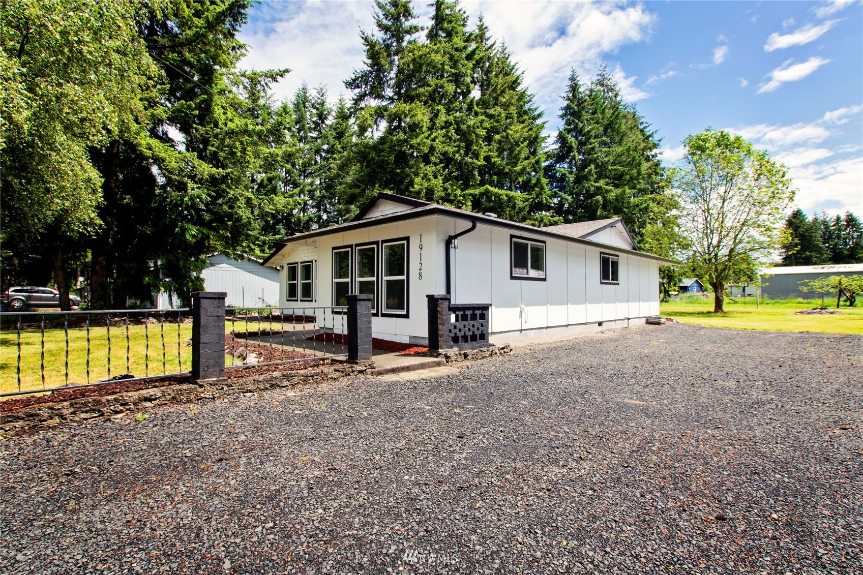 19128 Pecan Street Southwest Rochester, WA 98579 - Photo 2 of 31 a view of a house with swimming pool and sitting area