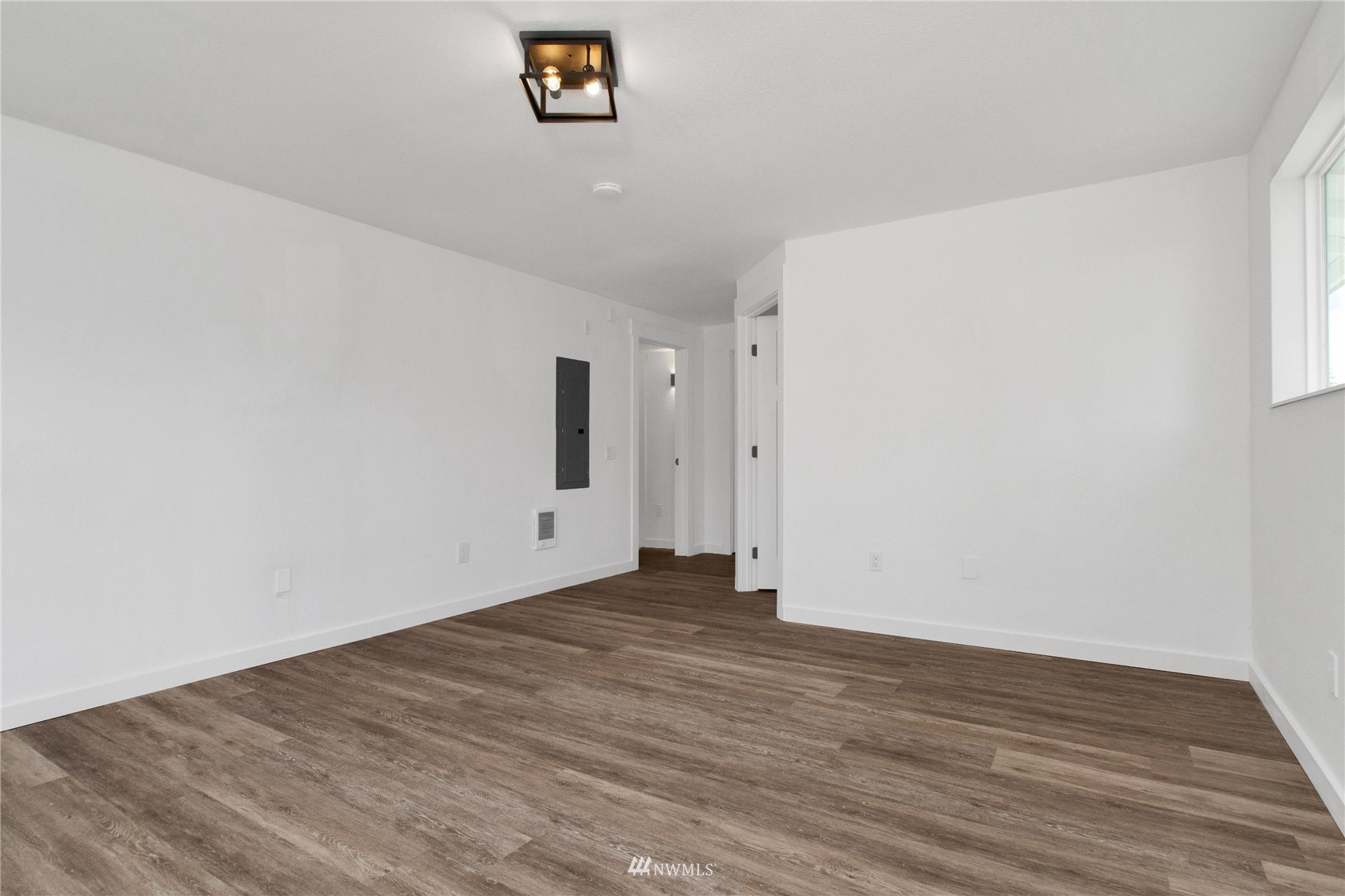 19128 Pecan Street Southwest Rochester, WA 98579 - Photo 24 of 31 a view of an empty room with wooden floor