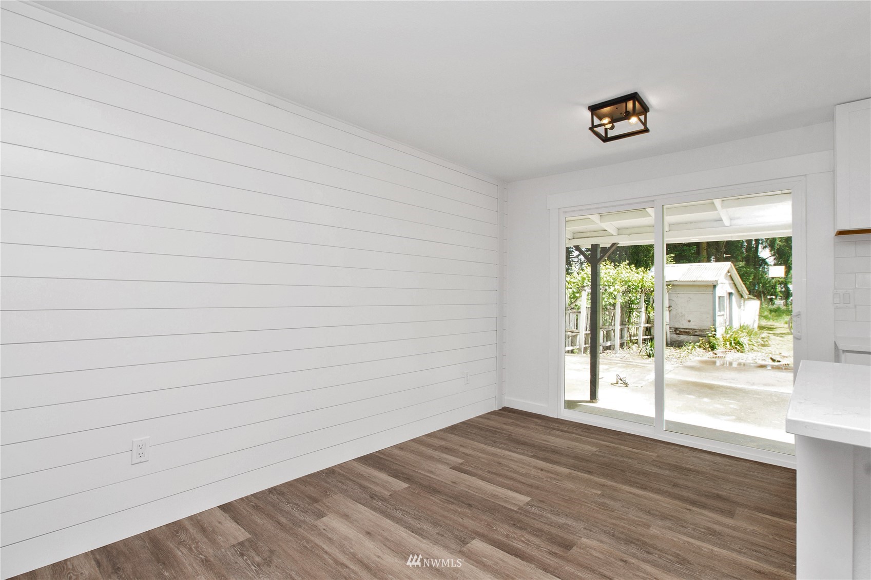 19128 Pecan Street Southwest Rochester, WA 98579 - Photo 6 of 31 a view of an empty room with wooden floor and a window