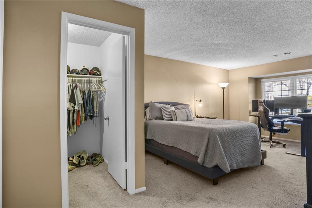 32 Springhedge Ct Street Smyrna, GA 30080 - Photo 13 of 29 a spacious bedroom with a bed and a view of bathroom