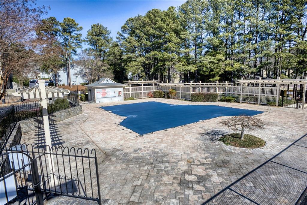 32 Springhedge Ct Street Smyrna, GA 30080 - Photo 25 of 29 a view of a swimming pool with a patio