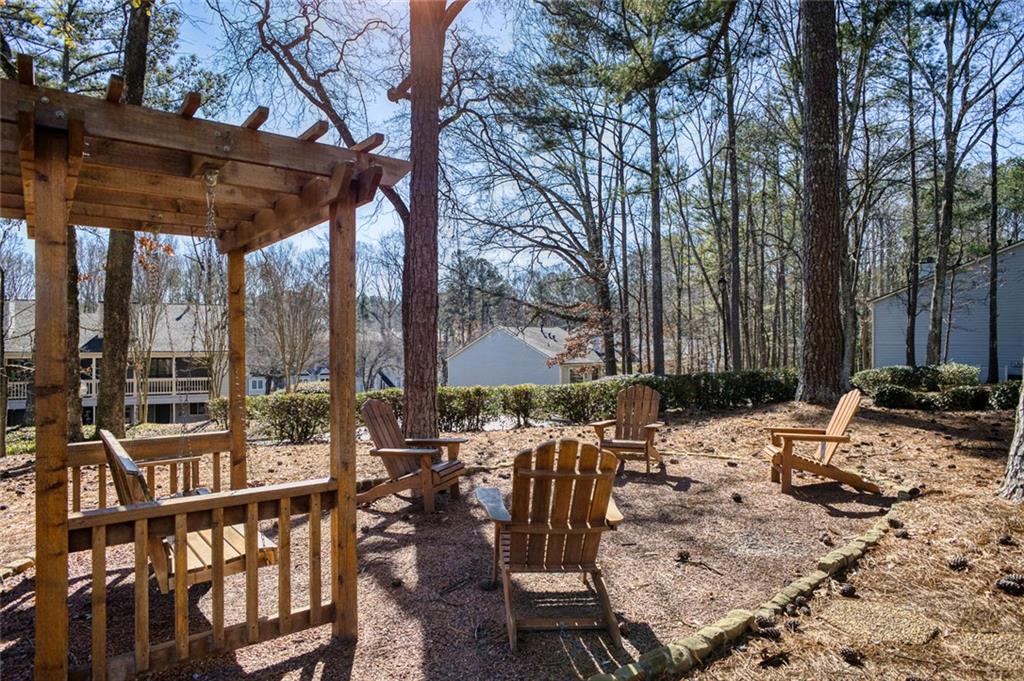 32 Springhedge Ct Street Smyrna, GA 30080 - Photo 26 of 29 a view of backyard with swimming pool and furniture