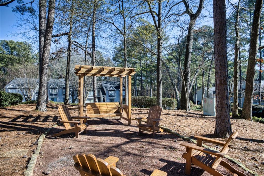 32 Springhedge Ct Street Smyrna, GA 30080 - Photo 27 of 29 a view of backyard with wooden fence and large trees