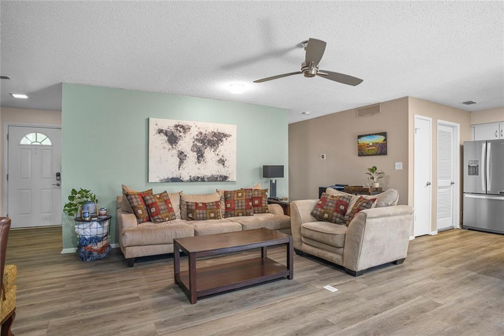 32 Springhedge Ct Street Smyrna, GA 30080 - Photo 4 of 29 a living room with furniture and a large window