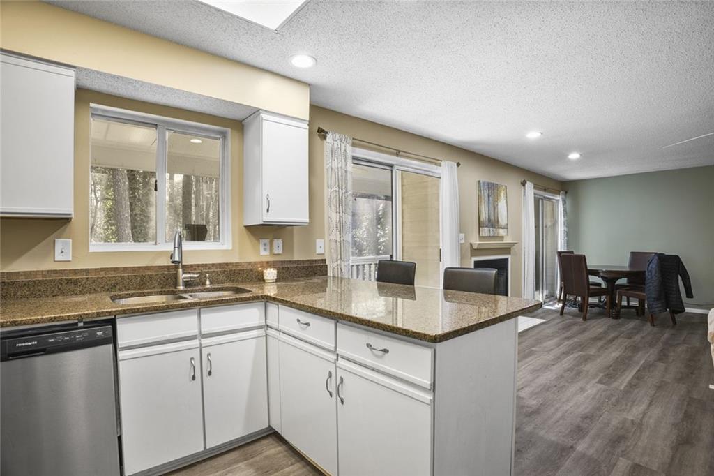 32 Springhedge Ct Street Smyrna, GA 30080 - Photo 6 of 29 a kitchen with stainless steel appliances granite countertop a sink stove and cabinets