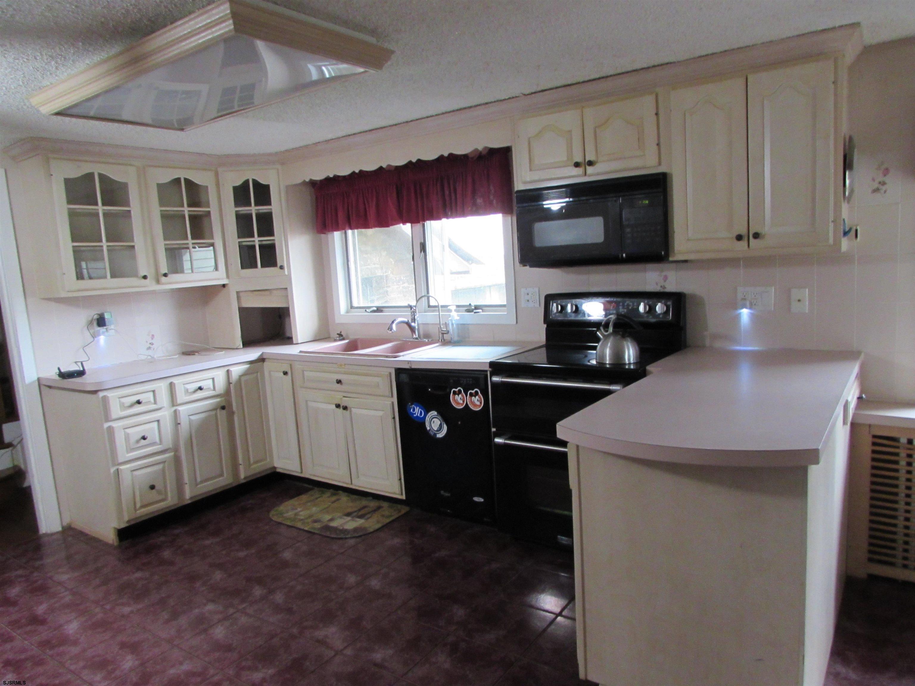 744 Shore Road Linwood, NJ 08221 - Photo 24 of 43 a kitchen with a sink stove and microwave