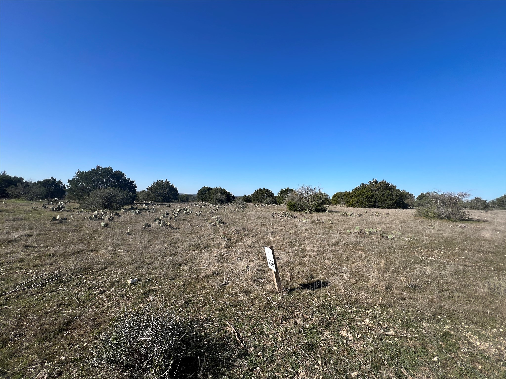 Lot 138 High Point Drive Kempner, TX 76539 - Photo 7 of 17 a view of a dry yard with wooden fence and mountain view