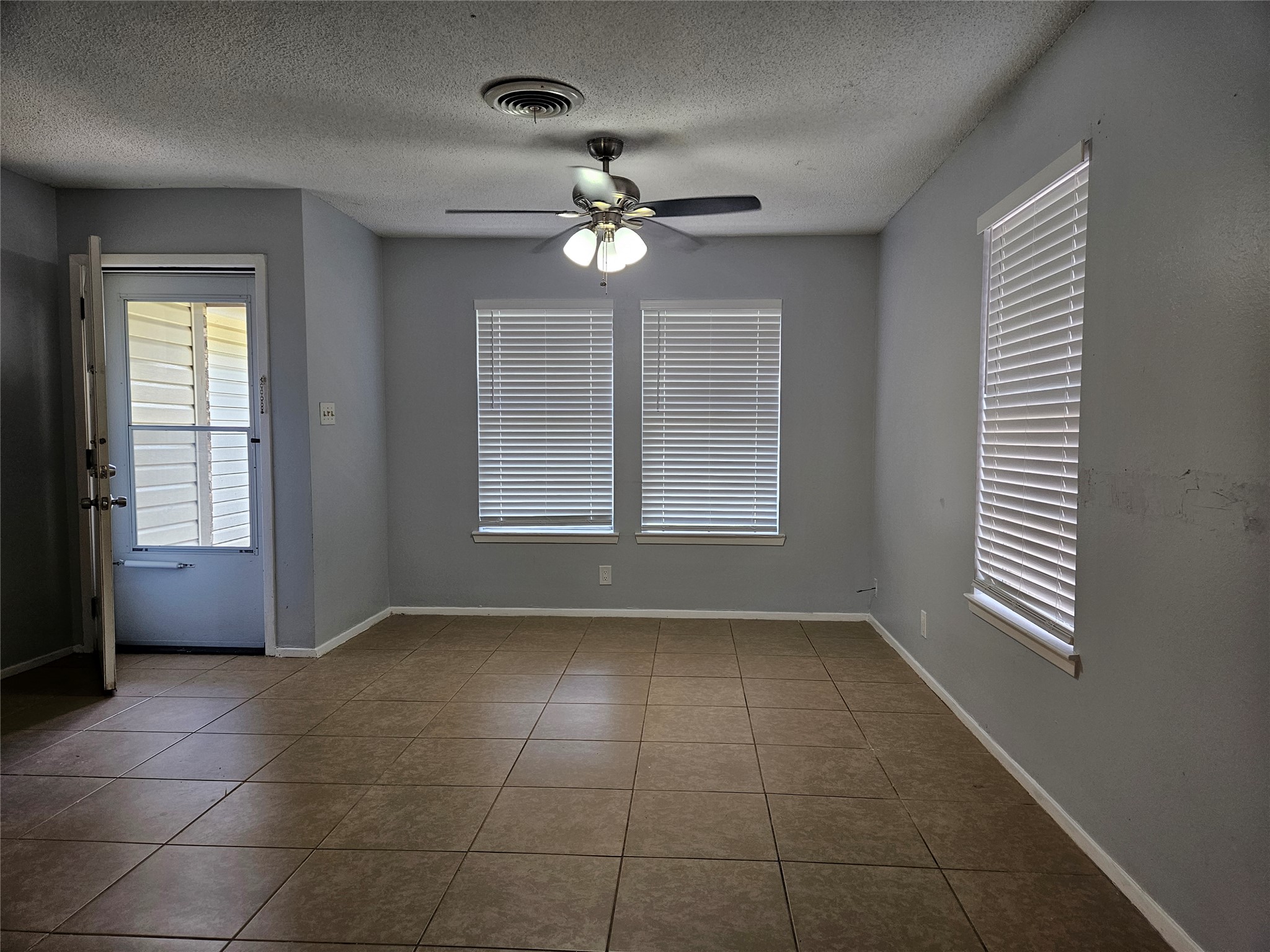 806 Ranch Road, Unit A Georgetown, TX 78628 - Photo 3 of 24 Natural light filters into this versatile living area, perfect for daily routines or gatherings.