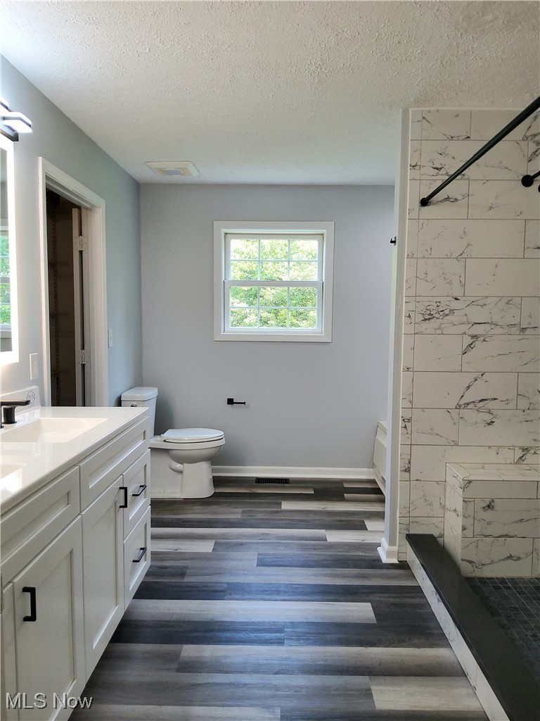 9415 Stone Road Litchfield, OH 44253 - Photo 16 of 28 Remodeled Master Bath, dual vanity, LED Mirrors, Tub, shower and large walk-in closet.