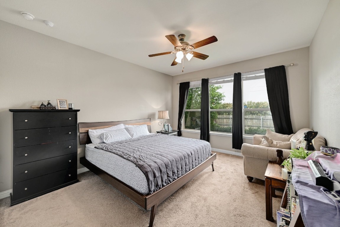 10104 Wading Pool Path Austin, TX 78748 - Photo 12 of 25 a bedroom with a large bed and a window