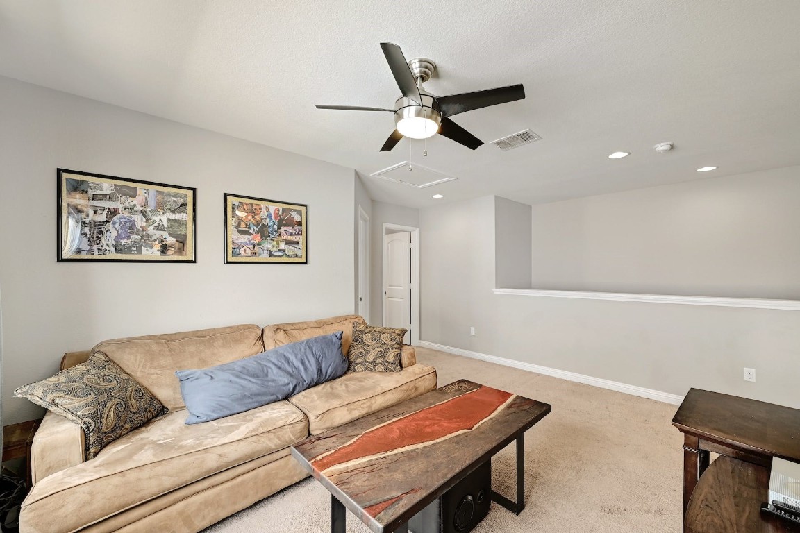 10104 Wading Pool Path Austin, TX 78748 - Photo 17 of 25 a living room with furniture and a ceiling fan